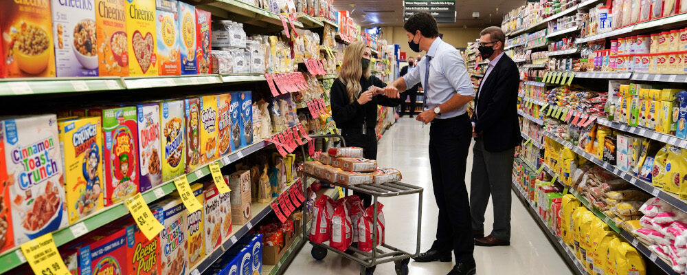 Liberal Leader Justin Trudeau meets with staff as he holds a campaign event at a grocery store in Winnipeg, Friday, Aug 20, 2021. Sean Kilpatrick/The Canadian Press. 