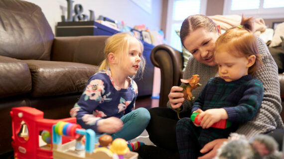 Joanna Dales plays with her children five-year-old Finleigh and 17-months-old Fiona at their home in London, Ontario on Friday, March 11, 2022. Geoff Robins/The Canadian Press. 