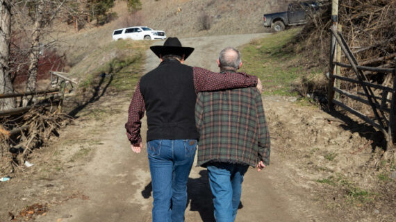 Shackan Indian Band Chief Arnie Lampreau (Swakum), left, puts his arm around Paulus Velt, west of Merritt, B.C., on Thursday, March 24, 2022. Darryl Dyck/The Canadian Press. 
