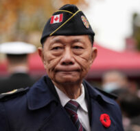Samuel Chan, an honorary member of the Army, Navy & Air Force Veterans in Canada, attends a Remembrance Day ceremony marking the sacrifices of the early Chinese pioneers and Chinese-Canadian military veterans, at the Chinatown Memorial Monument in Vancouver, Friday, Nov. 11, 2022. Darryl Dyck/The Canadian Press. 