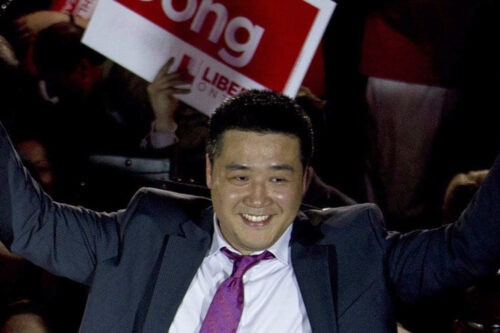 Former Liberal MP Han Dong celebrates with supporters while taking part in a rally in Toronto on Thursday, May 22, 2014. Nathan Denette/The Canadian Press.
