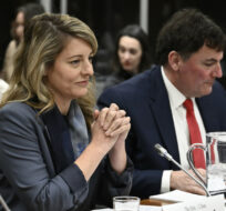 Minister of Foreign Affairs Mélanie Joly and Minister of Intergovernmental Affairs, Infrastructure and Communities Dominic LeBlanc prepare to appear before the Standing Committee on Procedure and House Affairs to answer questions on foreign election interference on Parliament Hill in Ottawa on March 9, 2023. Justin Tang/The Canadian Press.