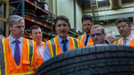 Prime Minister Justin Trudeau inspects a tire on the production line at the Michelin plant in Bridgewater, N.S., March 14, 2023. Riley Smith/The Canadian Press.