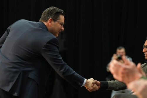 Conservative Leader Pierre Poilievre shakes hands with people as he arrives in New Westminster, B.C., on March 14, 2023. Darryl Dyck/The Canadian Press.