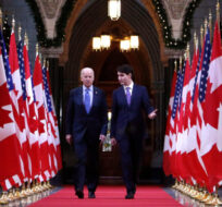 Prime Minister Justin Trudeau and US vice-president Joe Biden walk down the Hall of Honour on Parliament Hill in Ottawa on Friday, December 9, 2016. Patrick Doyle/The Canadian Press. 