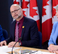 Carla Qualtrough, Minister of Employment, Workforce Development and Disability Inclusion, left to right, David Lametti, Minister of Justice and Attorney General of Canada, and Patty Hajdu, Minister of Health, make an announcement regarding a Bill entitled "An Act to amend the Criminal Code (medical assistance in dying)" during a press conference at the National Press Theatre in Ottawa on Monday Feb. 24, 2020. Sean Kilpatrick/The Canadian Press. 