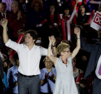 Ontario Premiere Kathleen Wynne, second right, along with Liberal leader of Canada Justin Trudeau, second left, federal candidate Adam Vaughan, left, and provincial candidate Han Dong, right, celebrate with supporters on May 22, 2014. Nathan Denette/The Canadian Press.