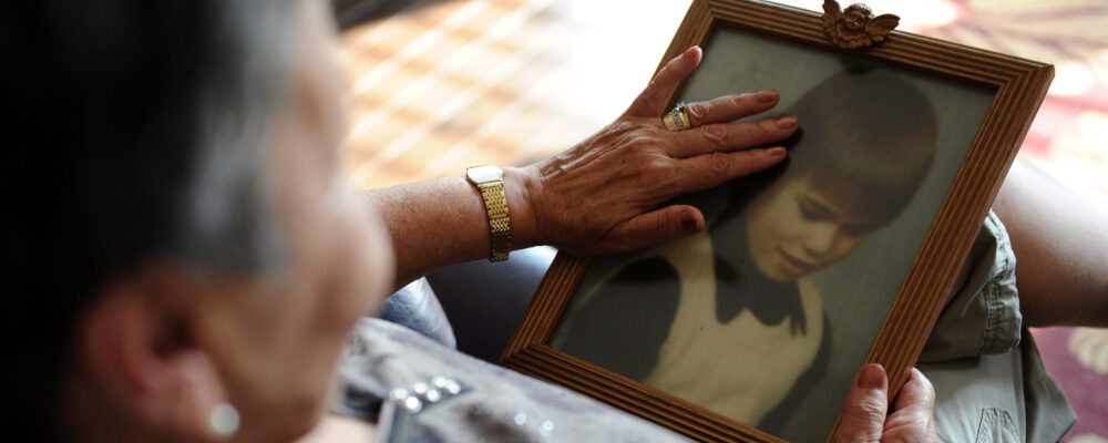 Sharon Rosenfeldt holds a photo of her late son Daryn Johnsrude at her home in Carleton Place, Ont., on Wednesday, September 21, 2011. Daryn was killed at the age of 16 by serial killer Clifford Olson. Sean Kilpatrick/The Canadian Press. 