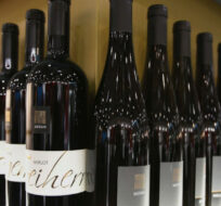 Bottles of red wine are on display at the 46th edition of the annual International Wine and Spirits Exhibition "Vinitaly", in Verona, northern Italy, Monday, March 26, 2012. Luca Bruno/AP Photo.