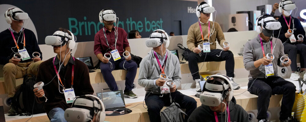 Attendees wear VR headsets while previewing the Caliverse Hyper-Realistic Metaverse experience at the Lotte booth during the CES tech show Friday, Jan. 6, 2023, in Las Vegas. John Locher/AP Photo.