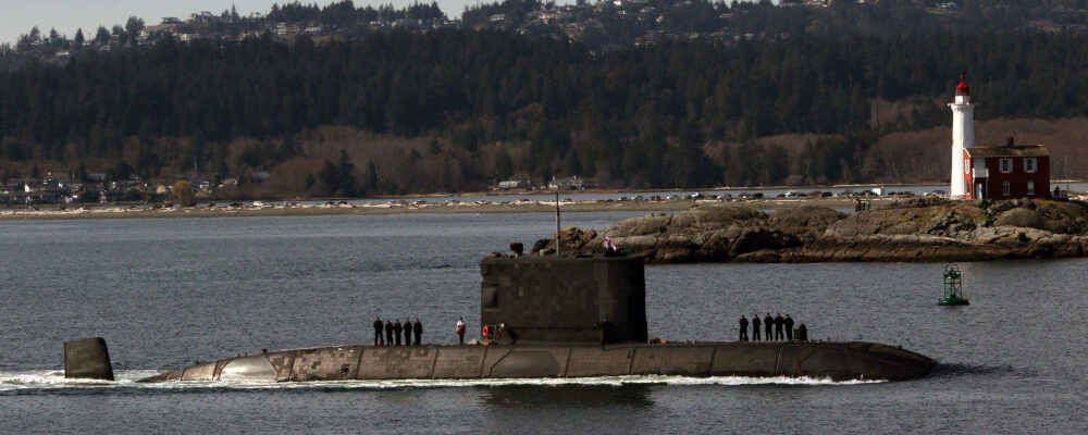 A crew of 59 aboard the HMCS Chicoutimi pass by Fisgard Lighthouse as they arrives at CFB Esquimalt, B.C., on Wednesday, March 21, 2018. Chad Hipolito/The Canadian Press. 