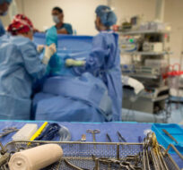 Sterile instruments are laid out as a patient is prepped to have a cyst removed from his right knee at the Cambie Surgery Centre, in Vancouver on August 31, 2016. Darryl Dyck/The Canadian Press.