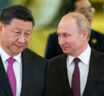 Chinese President Xi Jinping, left, and Russian President Vladimir Putin enter a hall for talks in the Kremlin in Moscow, Russia, June 5, 2019. Alexander Zemlianichenko/AP Photo. 