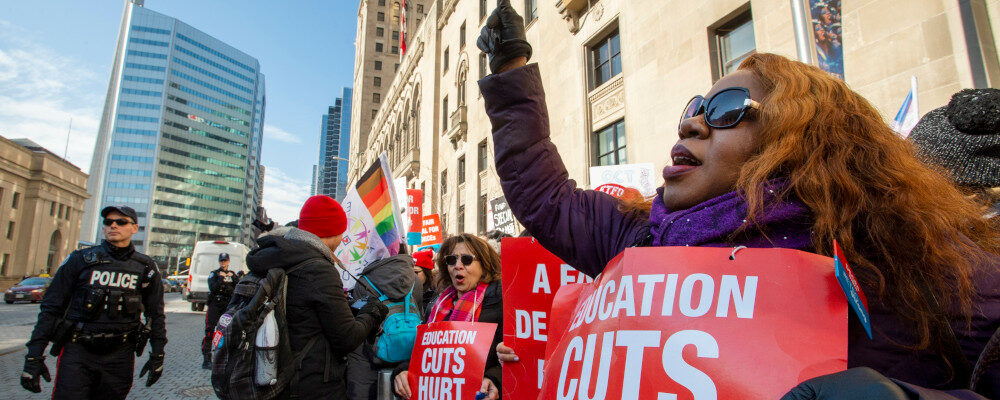 Striking school teachers protest outside a speech by Ontario Education Minister Stephen Lecce in Toronto on Wednesday, February 12, 2020. Frank Gunn/The Canadian Press. 