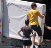 People load a truck with belongings as they move on Canada Day in Montreal, Wednesday, July 1 2020. Graham Hughes/The Canadian Press. 