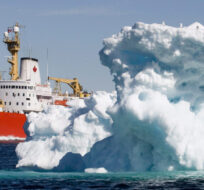 The Canadian Coast Guard icebreaker Louis S. St-Laurent sails past a iceberg in Lancaster Sound on July 11, 2008.  Jonathan Hayward/The Canadian Press.