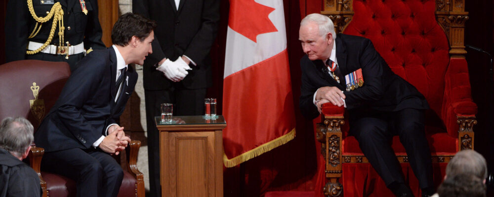 Prime Minister Justin Trudeau, left, speaks with Governor General David Johnston following the speech from the throne in the Senate Chamber on Parliament Hill in Ottawa, Friday December 4, 2015. Sean Kilpatrick/The Canadian Press. 