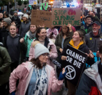 Protesters with the group Extinction Rebellion march through the streets of downtown Vancouver during a demonstration to bring awareness to climate change on Friday October 18, 2019. Darryl Dyck/The Canadian Press. 