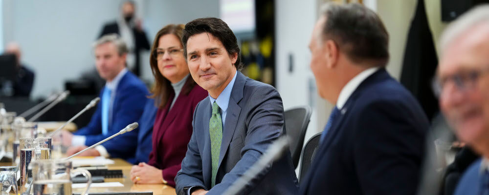 Prime Minister Justin Trudeau sits beside Manitoba Premier Heather Stefanson, left, and Quebec Premier Francois Legault, right as he meets with Canada's premiers in Ottawa on Tuesday, Feb. 7, 2023 in Ottawa. Sean Kilpatrick/The Canadian Press. 