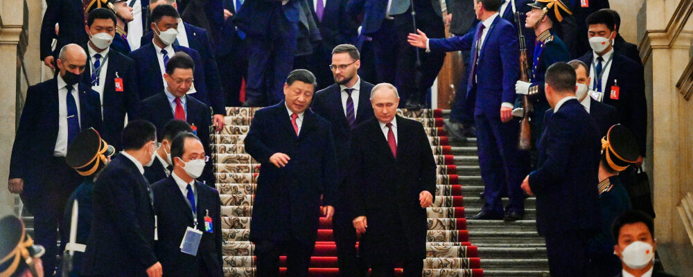 Chinese President Xi Jinping, center left, and Russian President Vladimir Putin, center right, step down after their dinner at The Palace of the Facets in the Moscow Kremlin, Russia, Tuesday, March 21, 2023. Pavel Byrkin/Kremlin Pool Photo via AP.