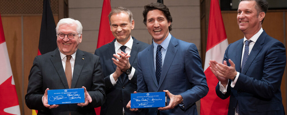 CEO of Volkswagen Group Oliver Blume (second from left) and board member Thomas Schmall applaud as Prime Minister Justin Trudeau and German President Frank-Walter Steinmeier hold up EV battery cells they signed during an event on Parliament Hill, Monday, April 24, 2023 in Ottawa. Adrian Wyld/The Canadian Press.