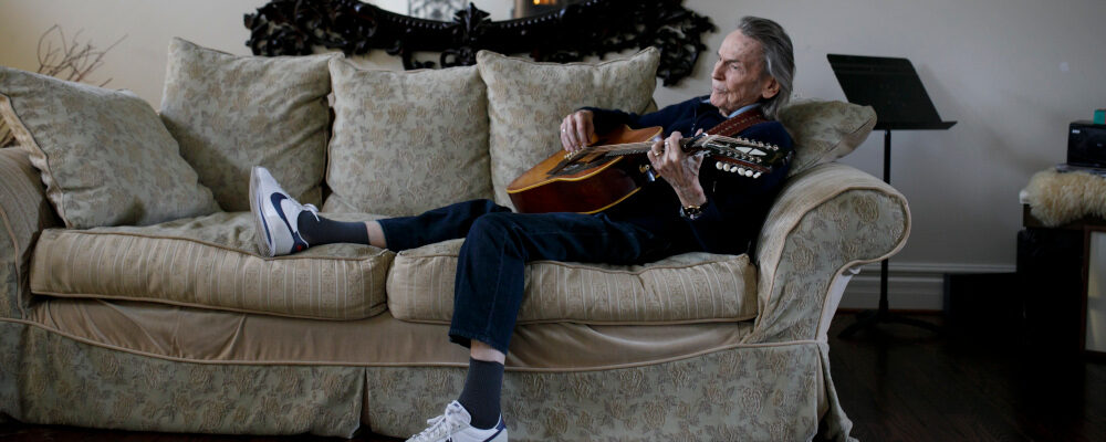 Canadian musician Gordon Lightfoot strums his guitar as he poses for a photograph in his Toronto home on Thursday, April 25, 2019. Cole Burston/The Canadian Press. 