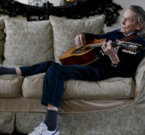 Canadian musician Gordon Lightfoot strums his guitar as he poses for a photograph in his Toronto home on Thursday, April 25, 2019. Cole Burston/The Canadian Press. 