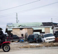 A man rides his ATV in the northern Ontario First Nations reserve in Attawapiskat, Ont., on Tuesday, April 19, 2016. Nathan Denette/The Canadian Press. 