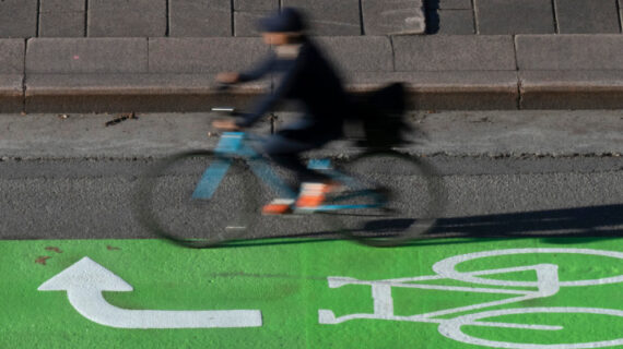 A cyclist makes their way along a roadway in a lane marked for bicycles, Wednesday, Nov. 2, 2022 in Ottawa. Adrian Wyld/The Canadian Press. 