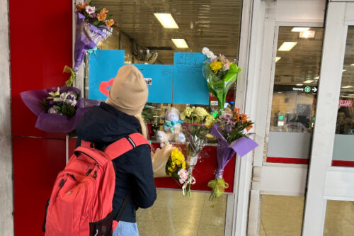 A person adds to the memorial for 16-year-old Gabriel Magalhaes at the Keele Street subway station in Toronto, Monday, March 27, 2023. Sharif Hassan/The Canadian Press. 