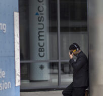 An unidentified man is pictured outside the CBC building in downtown Toronto. Chris Young/The Canadian Press.