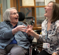 Ronnie Nishmas, left, who lives with dementia, laughs with recreation therapist Rachel Gavendo while participating in a dance class at a hospital in Toronto on Tuesday, December 9, 2014. Darren Calabrese/The Canadian Press. 