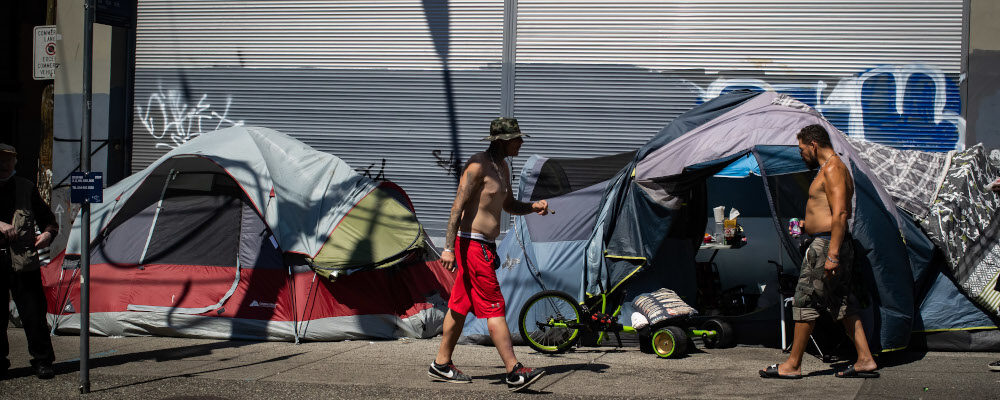 Tents line the sidewalk on East Hastings Street in the Downtown Eastside of Vancouver, on Thursday, July 28, 2022. Darryl Dyck/The Canadian Press. 