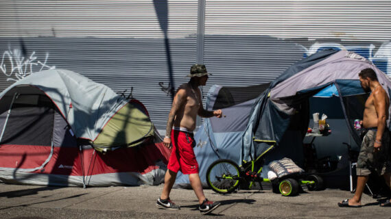 Tents line the sidewalk on East Hastings Street in the Downtown Eastside of Vancouver, on Thursday, July 28, 2022. Darryl Dyck/The Canadian Press. 