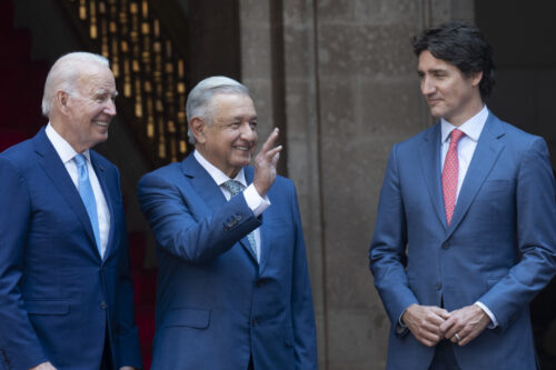 Mexican President Andres Manuel Lopez Obrador waves as he poses with United States President Joe Biden and Prime Minister Justin Trudeau for an official photo at the North American Leaders Summit on Jan. 10, 2023 in Mexico City, Mexico. Adrian Wyld/The Canadian Press.