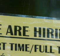 A sign for help wanted is pictured in a business window in Ottawa. Sean Kilpatrick/The Canadian Press.