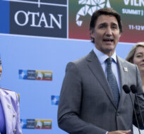Flanked by Minister of Defence Anita Anand and Foreign Affairs Minister Melanie Joly, Prime Minister Justin Trudeau
speaks to media at the NATO Summit, Tuesday, July 11, 2023 in Vilnius, Lithuania.  Adrian Wyld/The Canadian Press. 