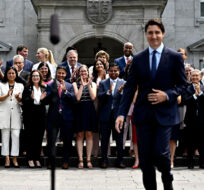 Members of the federal cabinet applaud as Prime Minister Justin Trudeau arrives for a media availability after a cabinet shuffle, at Rideau Hall in Ottawa, on Wednesday, July 26, 2023. Justin Tang/The Canadian Press. 