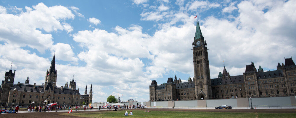 Canadian Flags fly on the empty lawn of Parliament Hill on Canada Day in Ottawa, on Wednesday, July 1, 2020. Justin Tang/The Canadian Press. 