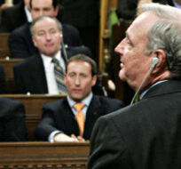 Consevative Leader Stephen Harper watches as Prime Minister Paul Martin votes against his non-confidence motion triggering a federal election on Nov 28, 2005. Tom Hanson/The Canadian Press.