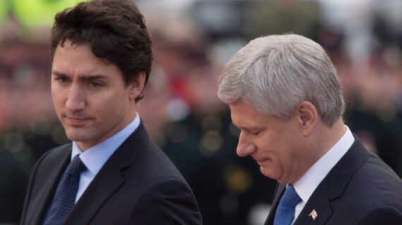 Prime Minister Stephen Harper and prime minister designate Justin Trudeau walk together during a ceremony marking the one year anniversary of the attack on Parliament hill Thursday Oct. 22, 2015 at the National War Memorial in Ottawa. Sean Kilpatrick/The Canadian Press. 