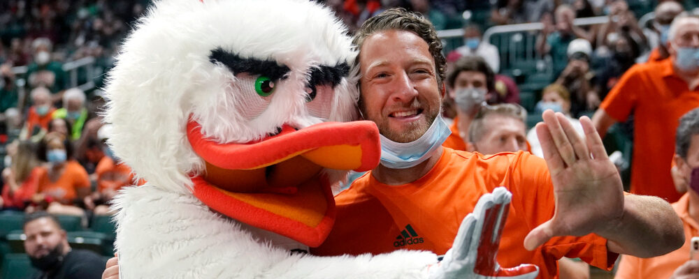 Barstool Sports blogger David Portnoy, right, poses with the Miami mascot Sebastian the Ibis during the first half of an NCAA college basketball game against Florida State, Saturday, Jan. 22, 2022, in Coral Gables, Fla. Lynne Sladky/AP Photo. 