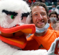 Barstool Sports blogger David Portnoy, right, poses with the Miami mascot Sebastian the Ibis during the first half of an NCAA college basketball game against Florida State, Saturday, Jan. 22, 2022, in Coral Gables, Fla. Lynne Sladky/AP Photo. 