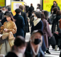 People crowd the street at Shinjuku area in Tokyo, Japan, Thursday, Feb. 17, 2022. Shuji Kajiyama/AP Photo. 