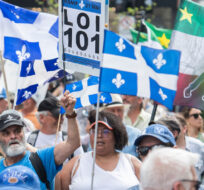 People take part in a march in support of Bill 101 in Montreal, Saturday, May 21, 2022. Graham Hughes/The Canadian Press. 