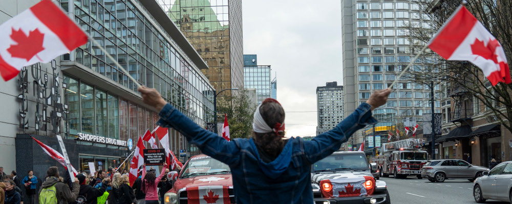 Protesters gather at the Fairmont Hotel Vancouver where Prime Minister Justin Trudeau is scheduled to speak at a Liberal Party event in Vancouver, B.C. on Tuesday March 29, 2022. Jimmy Jeong/The Canadian Press. 