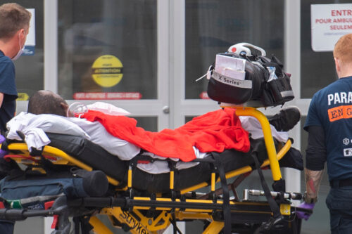 Paramedics transfer a person into a hospital in Montreal, Thursday, July 14, 2022. Graham Hughes/The Canadian Press. 