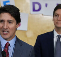 Prime Minister Justin Trudeau speaks as B.C. Premier David Eby, back right, listens during a child care announcement at the Richmond Jewish Day School, in Richmond, B.C., on Friday, December 2, 2022. Darryl Dyck/The Canadian Press. 