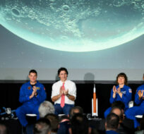 The crew of Artemis II, Reid Wiseman, second from left, Jeremy Hansen, Christine Hammock Koch and Victor Glover, are applauded by Canadian Space Agency President Lisa Campbell, left, Prime Minister Justin Trudeau, and NASA Administrator Bill Nelson, right, during a presentation at the Canada Aviation and Space Museum in Ottawa, on Tuesday, April 25, 2023. Justin Tang/The Canadian Press. 