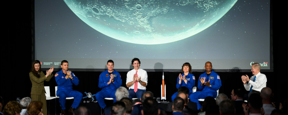 The crew of Artemis II, Reid Wiseman, second from left, Jeremy Hansen, Christine Hammock Koch and Victor Glover, are applauded by Canadian Space Agency President Lisa Campbell, left, Prime Minister Justin Trudeau, and NASA Administrator Bill Nelson, right, during a presentation at the Canada Aviation and Space Museum in Ottawa, on Tuesday, April 25, 2023. Justin Tang/The Canadian Press. 